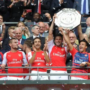 Arsenal's FA Community Shield Winning Team: Debuchy, Flamini, Giroud, Sanchez, Oxlade-Chamberlain Celebrate Victory Arsenal's FA Community Shield Winning Team: Debuchy, Flamini, Giroud, Sanchez, Oxlade-Chamberlain Celebrate Victory