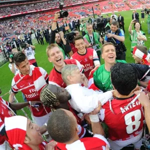 Arsenal's FA Cup Triumph: Arsene Wenger and the Jubilant Squad Celebrate