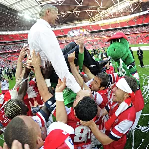 Arsenal's FA Cup Triumph: Wenger Lifted High Amidst Jubilant Squad