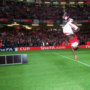 Arsenal's FA Cup Victory: Kolo Toure's Euphoric Backflip at the Millennium Stadium, 2003 Arsenal's FA Cup Victory: Kolo Toure's Euphoric Backflip at the Millennium Stadium, 2003