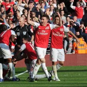 Arsenal's Five-Goal Blitz: Koscielny and Arteta Celebrate Walcott's Goal vs. Tottenham (2011-12)