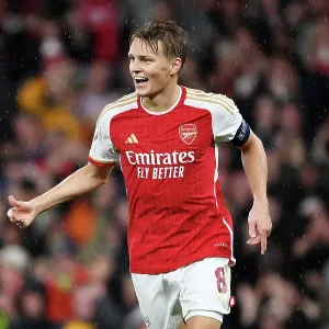 Arsenal's Four-Goal Blitz: Martin Odegaard Celebrates Against PSV Eindhoven in the 2023-24 UEFA Champions League