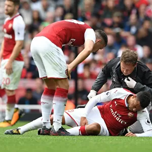 Arsenal's Francis Coquelin Receives Treatment from Physio Colin Lewin vs AFC Bournemouth