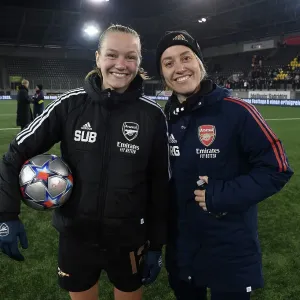 Arsenal's Frida Maanum Receives Medical Attention from Team Physio During UEFA Champions League Match