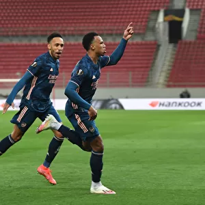 Arsenal's Gabriel and Aubameyang Celebrate Goals in Empty Karaiskakis Stadium during Olympiacos Clash in Europa League