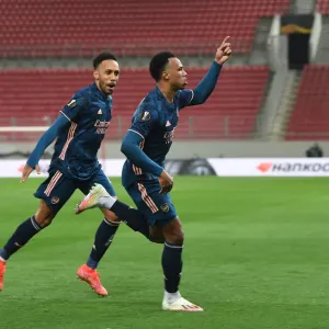 Arsenal's Gabriel and Aubameyang Celebrate Goals in Empty Karaiskakis Stadium during Olympiacos Clash in Europa League