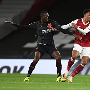 Arsenal's Gabriel Breaks Past Slavia Praha's Sima in Empty Europa League Quarterfinal