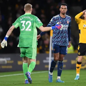 Arsenal's Gabriel Magalhaes and Aaron Ramsdale Celebrate at Molineux: Wolverhampton Wanderers vs. Arsenal, Premier League 2021-22
