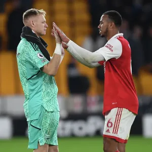 Arsenal's Gabriel Magalhaes and Aaron Ramsdale Celebrate Victory over Wolverhampton Wanderers in the 2022-23 Premier League