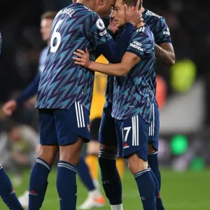 Arsenal's Gabriel Magalhaes and Cedric Soares Celebrate Victory Over Wolverhampton Wanderers in Premier League