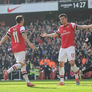 Arsenal's Giroud and Ozil Celebrate Goals in FA Cup Quarter-Final Victory