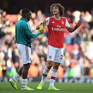 Arsenal's Glory: Lacazette and Luiz Celebrate Derby Victory over Tottenham (2019-20)