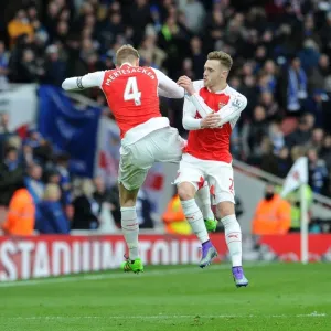 Arsenal's Glory: Mertesacker and Chambers Celebrate Premier League Victory over Leicester City Arsenal's Glory: Mertesacker and Chambers Celebrate Premier League Victory over Leicester City