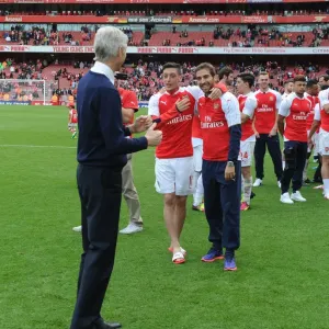 Arsenal's Glory: Wenger, Ozil, and Flamini Celebrate 2015-16 Premier League Victory Arsenal's Glory: Wenger, Ozil, and Flamini Celebrate 2015-16 Premier League Victory