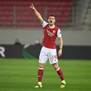 Arsenal's Granit Xhaka in Action Against SL Benfica in UEFA Europa League Round of 32