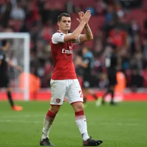Arsenal's Granit Xhaka Celebrates with Fans after Victory over Swansea City Arsenal's Granit Xhaka Celebrates with Fans after Victory over Swansea City