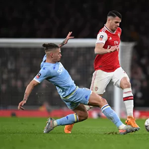 Arsenal's Granit Xhaka Outmaneuvers Leeds Kalvin Phillips in FA Cup Clash