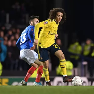 Arsenal's Guendouzi Clashes with Portsmouth's Close in FA Cup Fifth Round