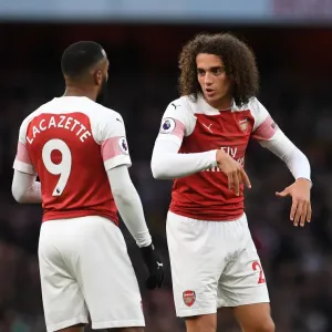 Arsenal's Guendouzi and Lacazette in Action against Huddersfield Town (2018-19) Arsenal's Guendouzi and Lacazette in Action against Huddersfield Town (2018-19)