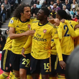 Arsenal's Guendouzi and Maitland-Niles Celebrate Goal Against Newcastle United (2019-20) Arsenal's Guendouzi and Maitland-Niles Celebrate Goal Against Newcastle United (2019-20)