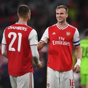 Arsenal's Holding and Chambers Celebrate Carabao Cup Victory over Nottingham Forest