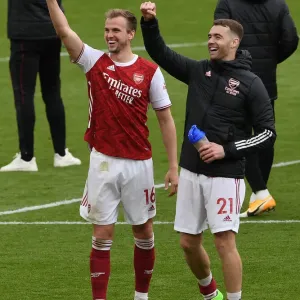 Arsenal's Holding and Chambers: Celebrating Victory Against Brighton in the 2020-21 Premier League Arsenal's Holding and Chambers: Celebrating Victory Against Brighton in the 2020-21 Premier League
