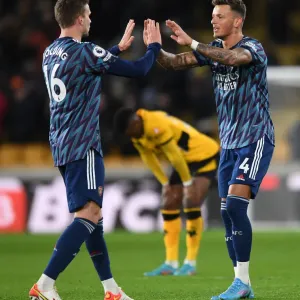 Arsenal's Holding and White Celebrate Victory Over Wolverhampton Wanderers in Premier League