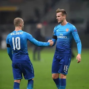 Arsenal's Holding and Wilshere Share a Moment after AC Milan Clash in Europa League Arsenal's Holding and Wilshere Share a Moment after AC Milan Clash in Europa League