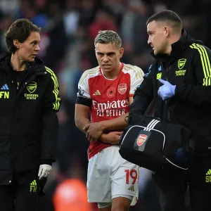 Arsenal's Injured Trossard Tended to by Medical Team During Arsenal v Burnley Match, 2023-24 Arsenal's Injured Trossard Tended to by Medical Team During Arsenal v Burnley Match, 2023-24