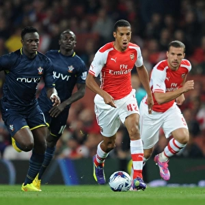 Arsenal's Isaac Hayden Outmaneuvers Victor Wanyama in Capital One Cup Clash