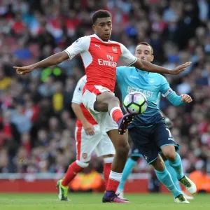 Arsenal's Iwobi Goes Head-to-Head with Swansea's Britton in Premier League Showdown