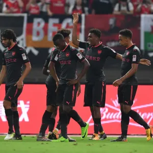 Arsenal's Iwobi, Nelson, and Bramall Celebrate Goal Against Bayern Munich in Shanghai Friendly, 2017