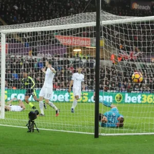 Arsenal's Iwobi Scores Deflected Goal Past Former Team-Mate Fabianski in Swansea Clash Arsenal's Iwobi Scores Deflected Goal Past Former Team-Mate Fabianski in Swansea Clash