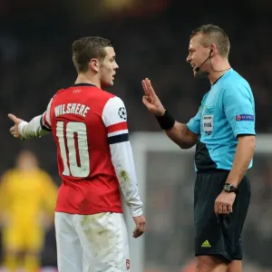 Arsenal's Jack Wilshere Argues with Referee Svein Oddvar Moen during Arsenal v Bayern Munich UEFA Champions League Match