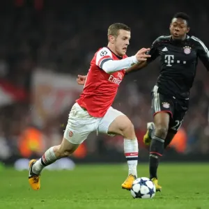 Arsenal's Jack Wilshere Clashes with Bayern Munchen's David Alaba in Champions League Showdown