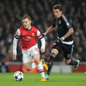 Arsenal's Jack Wilshere Clashes with Bayern's Mario Mandzukic in Champions League Showdown