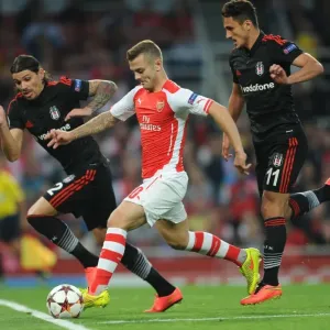 Arsenal's Jack Wilshere Clashes with Besiktas's Mustafa Pektemek and Ersan Gulum in UEFA Champions League Qualifier