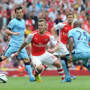 Arsenal's Jack Wilshere Clashes with Manchester City's David Silva and Fernandinho (2014-15)