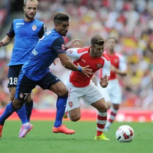 Arsenal's Jack Wilshere Clashes with AS Monaco's Nabil Dirar in 2014-15 Emirates Cup