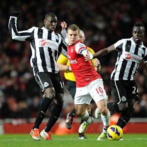 Arsenal's Jack Wilshere Clashes with Newcastle's Ba and Tiote in Premier League Showdown