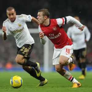 Arsenal's Jack Wilshere Clashes with Swansea's Ashley Richards in FA Cup Third Round Replay Arsenal's Jack Wilshere Clashes with Swansea's Ashley Richards in FA Cup Third Round Replay