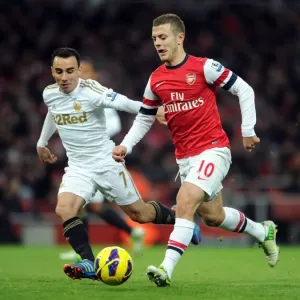 Arsenal's Jack Wilshere Clashes with Swansea's Leon Britton during the 2012-13 Premier League Match Arsenal's Jack Wilshere Clashes with Swansea's Leon Britton during the 2012-13 Premier League Match