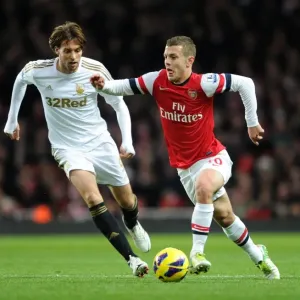 Arsenal's Jack Wilshere Clashes with Swansea's Miguel Michu in Premier League Showdown (2012-13) Arsenal's Jack Wilshere Clashes with Swansea's Miguel Michu in Premier League Showdown (2012-13)