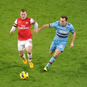 Arsenal's Jack Wilshere Clashes with West Ham's Mark Noble in Premier League Showdown