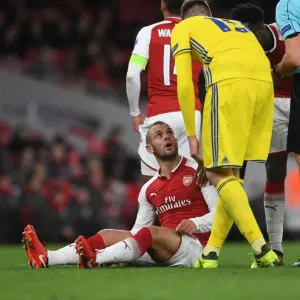 Arsenal's Jack Wilshere Confronts BATE Borisov's Nemanja Milunovic during Europa League Clash
