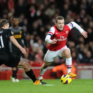Arsenal's Jack Wilshere Evades Liverpool's Lucas Leiva During Intense Premier League Clash