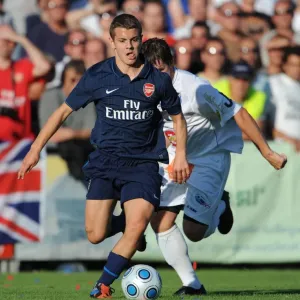 Arsenal's Jack Wilshere Faces Off Against Alexander Frimmel of SC Columbia in Pre-Season Friendly