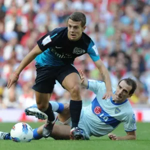 Arsenal's Jack Wilshere Faces Off Against Boca Juniors Leandro Somoza during the 2011-12 Emirates Cup Arsenal's Jack Wilshere Faces Off Against Boca Juniors Leandro Somoza during the 2011-12 Emirates Cup