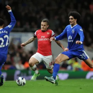 Arsenal's Jack Wilshere Faces Off Against Everton's Steven Pienaar and Marouane Fellaini