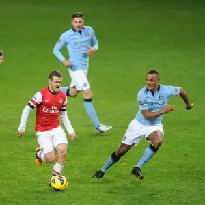 Arsenal's Jack Wilshere Faces Off Against Manchester City's Milner, Garcia, and Kompany Arsenal's Jack Wilshere Faces Off Against Manchester City's Milner, Garcia, and Kompany